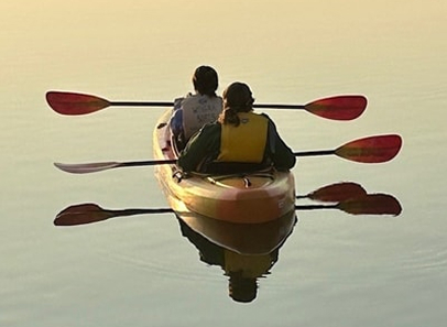 two people in tandem kayak