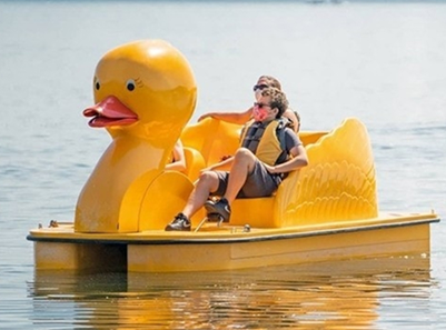 two people on duck paddle boat